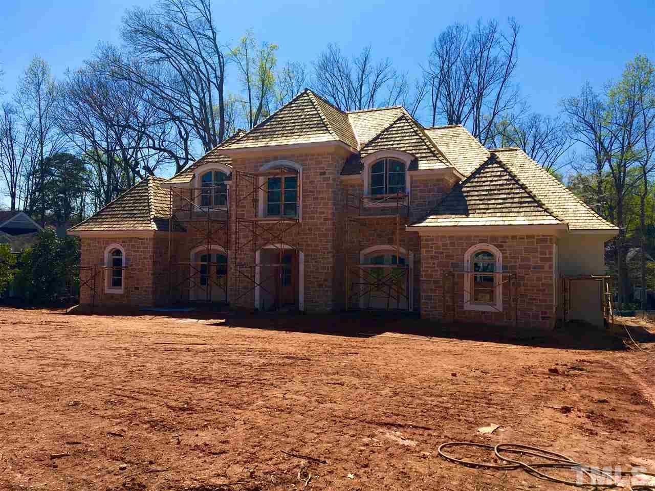 3133 Sussex Road Raleigh, NC 27607 - Photo 2 of 5 a front view of a house with a yard