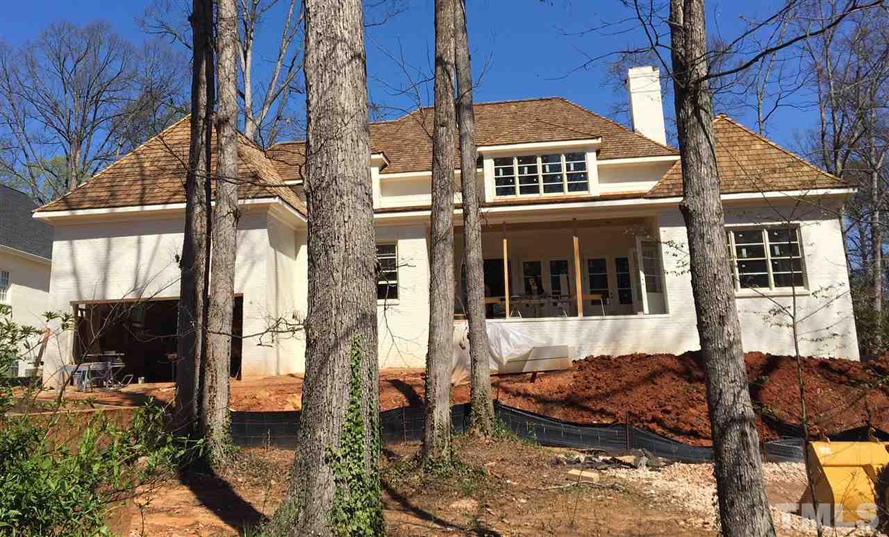 3133 Sussex Road Raleigh, NC 27607 - Photo 3 of 5 a front view of a house with a yard