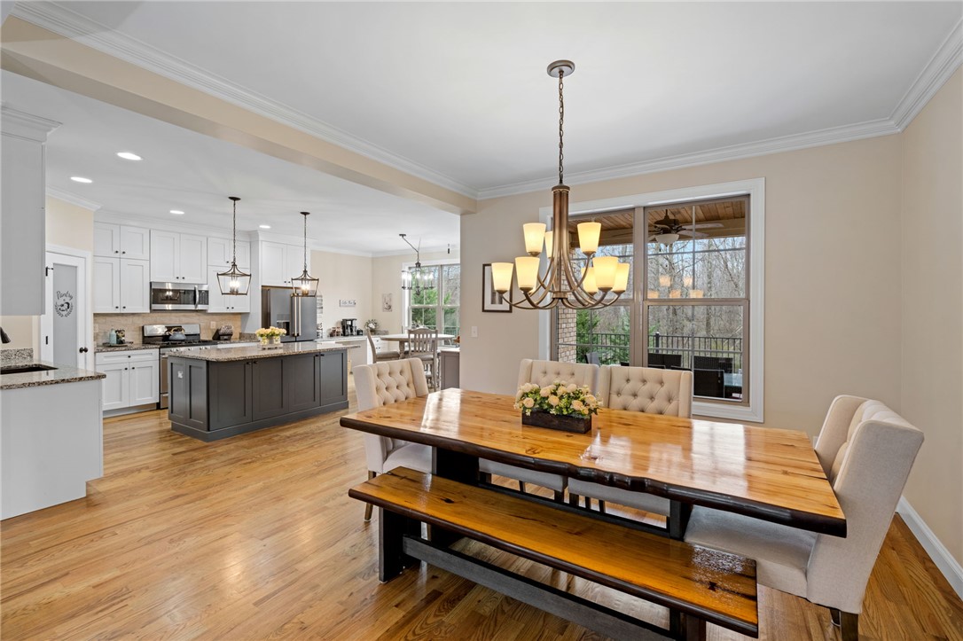 10 Colonel Storrs Court Greer, SC 29650 - Photo 14 of 48 An open-concept design with a kitchen and dining area provides the perfect setting for entertaining.