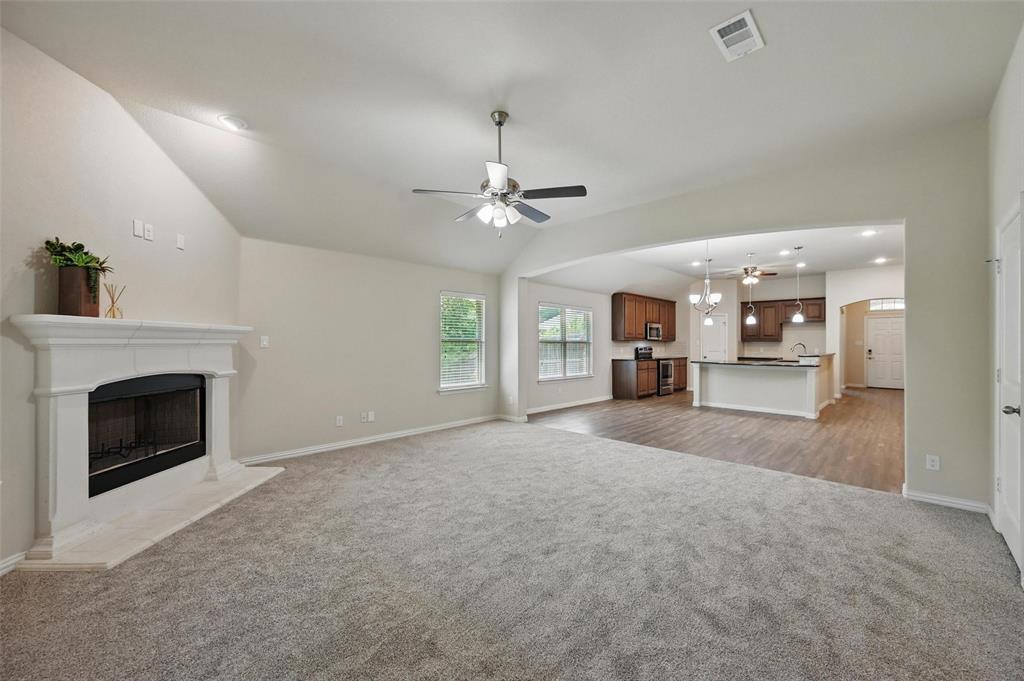 512 Hidden Spgs Trail Azle, TX 76020 - Photo 10 of 27 a view of a livingroom with a fireplace and window