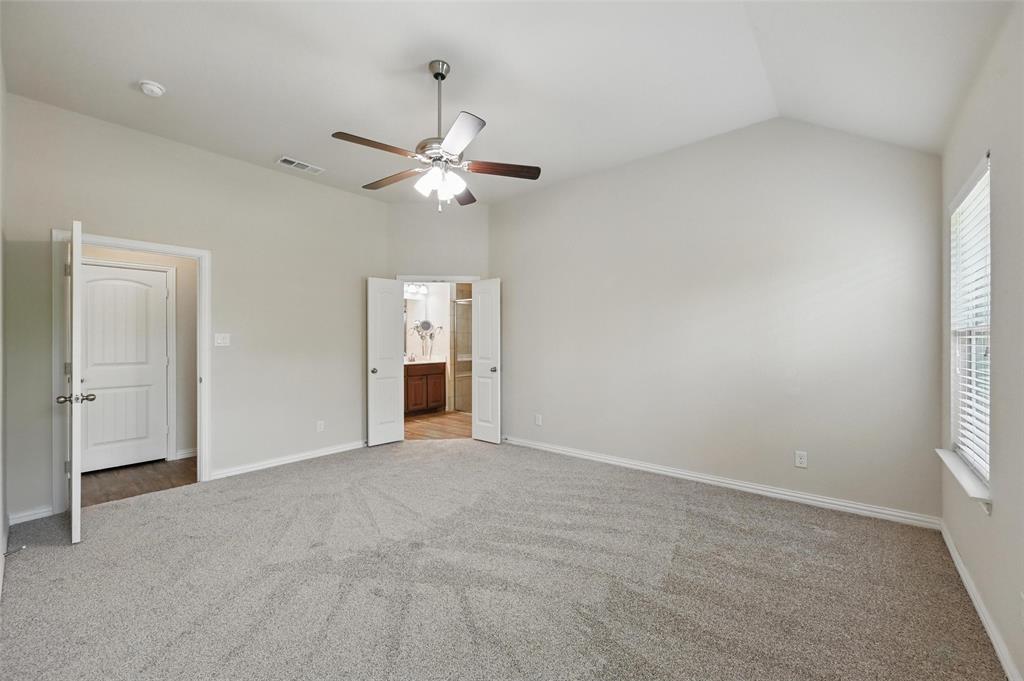 512 Hidden Spgs Trail Azle, TX 76020 - Photo 14 of 27 an empty room with windows and fan