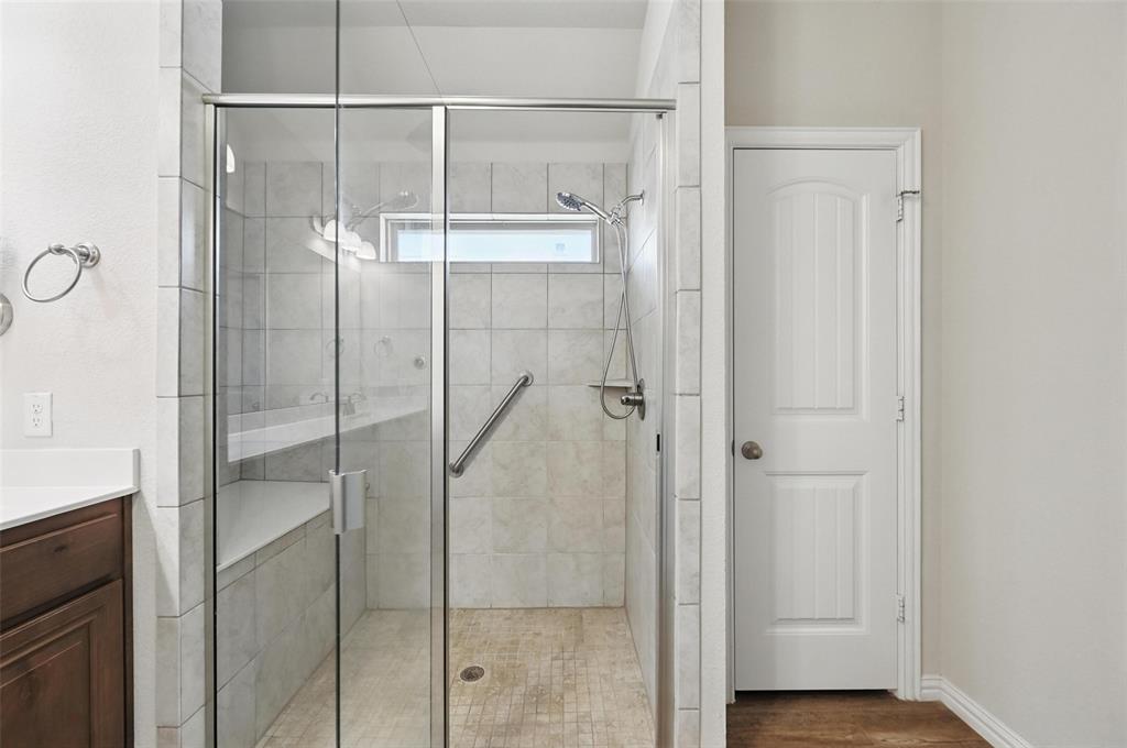 512 Hidden Spgs Trail Azle, TX 76020 - Photo 19 of 27 a bathroom with a glass shower door
