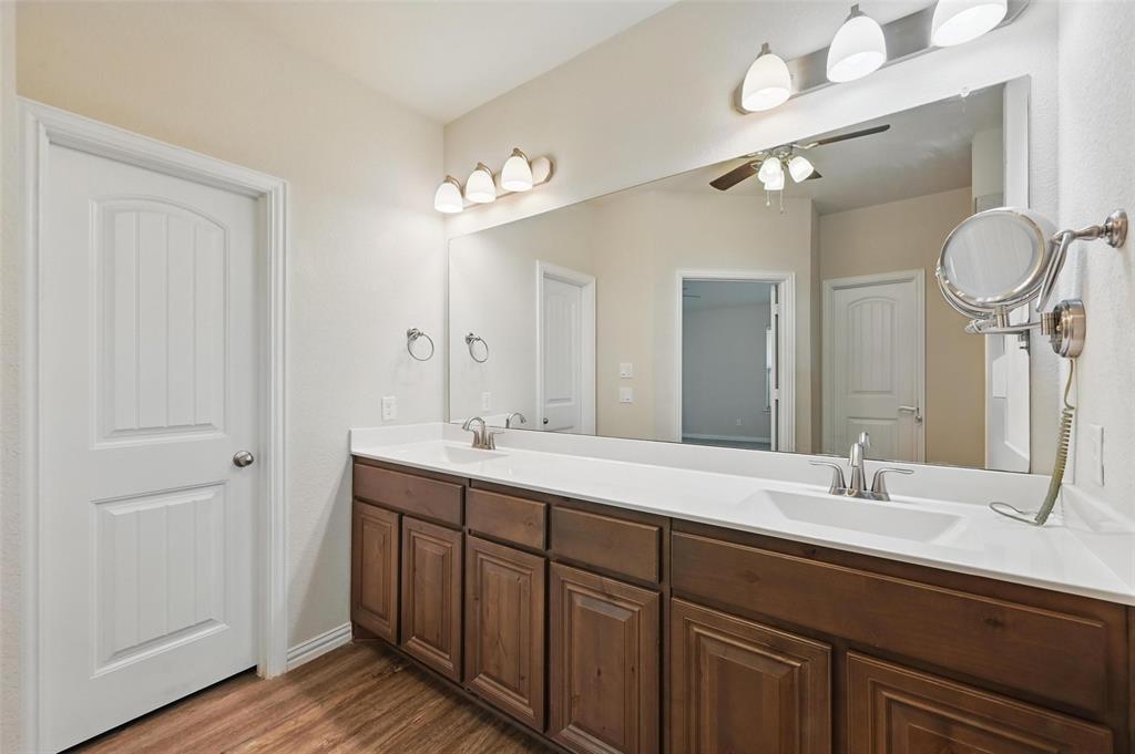 512 Hidden Spgs Trail Azle, TX 76020 - Photo 20 of 27 a bathroom with a double vanity sink and a mirror