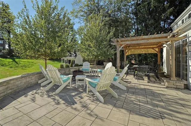 a view of an chairs and tables in the patio