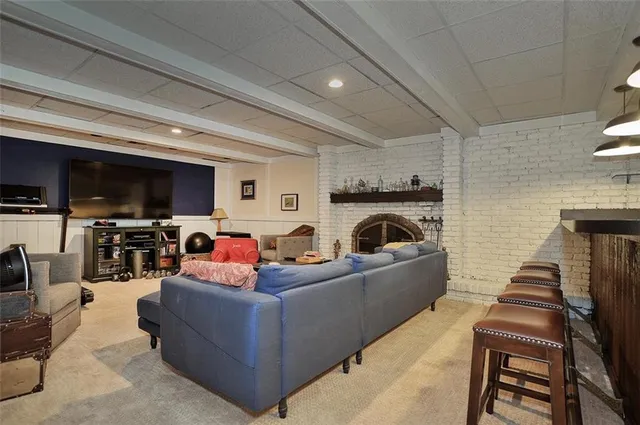 a living room with furniture a dining table and kitchen view