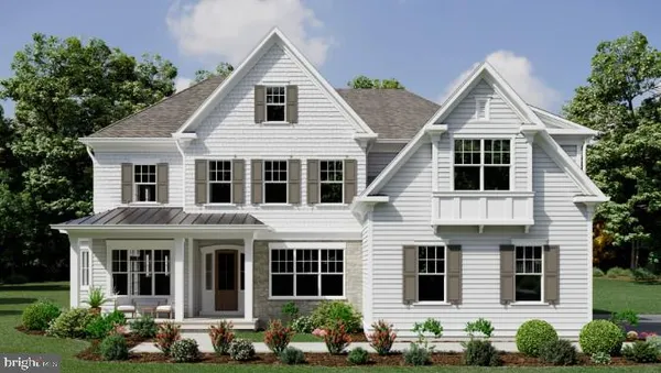 a front view of a house with large windows and potted plants