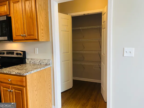a kitchen with a refrigerator and a stove