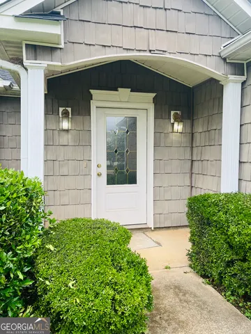 a view of a wooden door of the house