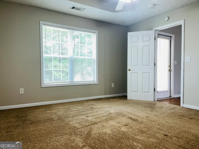 a view of an empty room with window