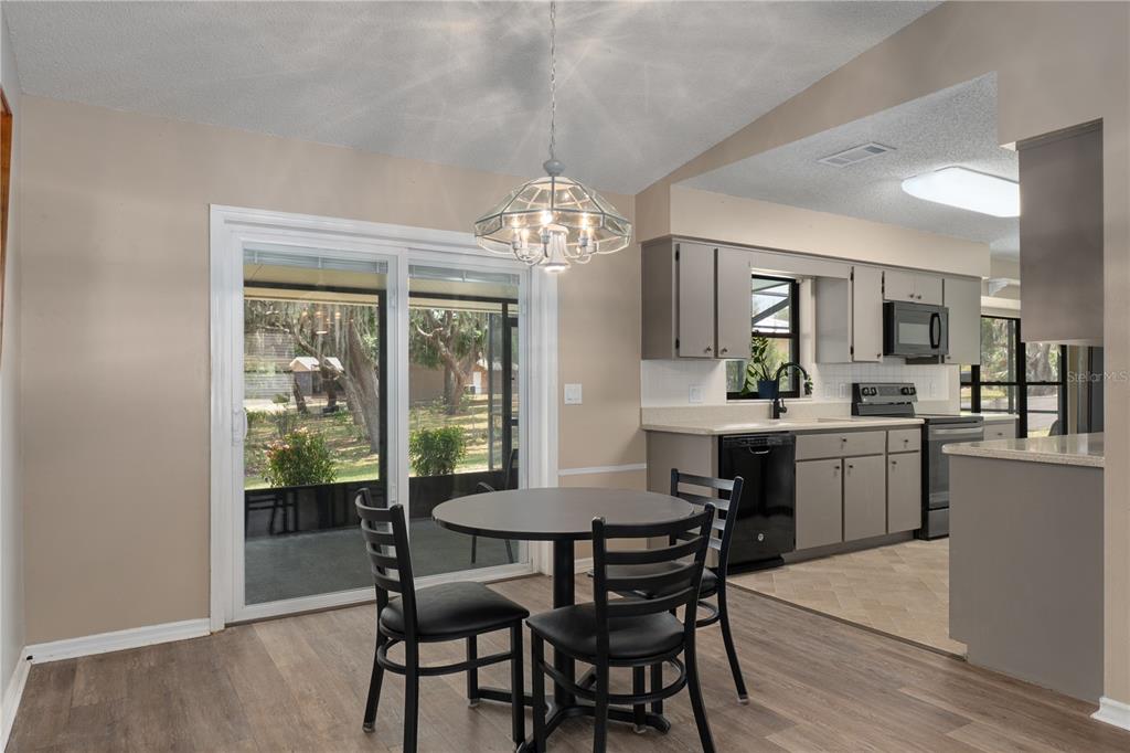 2481 South Summerwood Point Inverness, FL 34450 - Photo 12 of 38 a view of a dining room with furniture and window