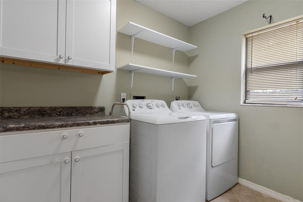 2481 South Summerwood Point Inverness, FL 34450 - Photo 23 of 38 a utility room with dryer and washer