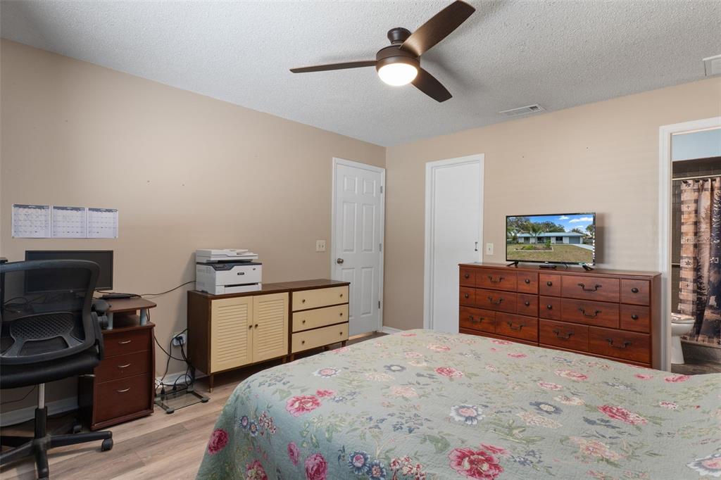 2481 South Summerwood Point Inverness, FL 34450 - Photo 24 of 38 a bedroom with a bed and wooden floor
