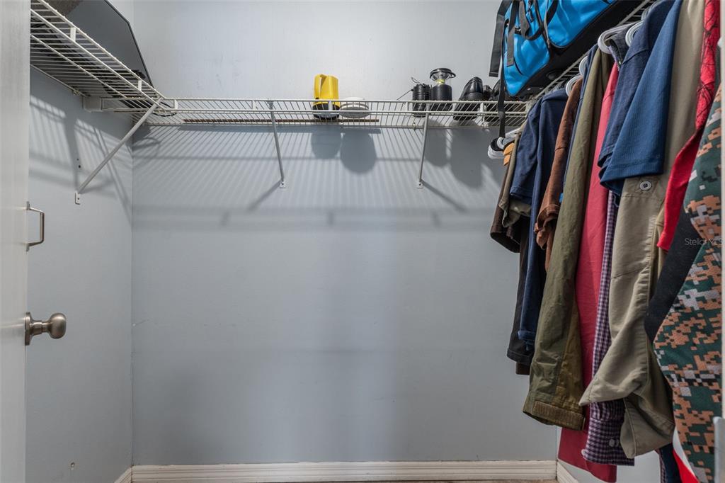 2481 South Summerwood Point Inverness, FL 34450 - Photo 26 of 38 a view of walk in closet with clothes and shoes
