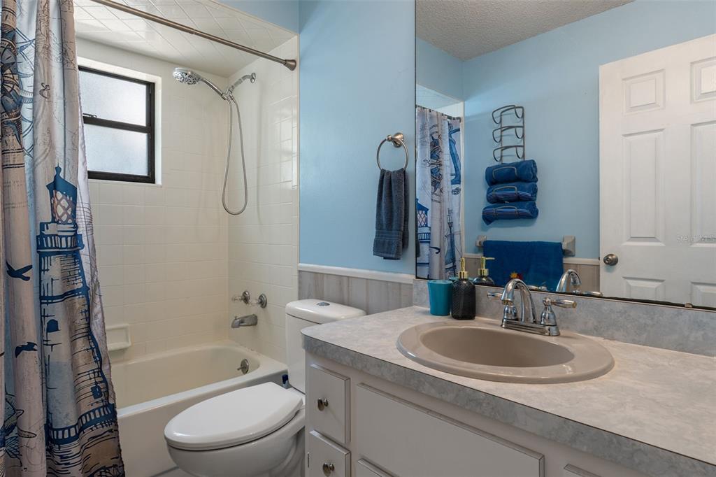 2481 South Summerwood Point Inverness, FL 34450 - Photo 28 of 38 a bathroom with a granite countertop sink toilet and shower