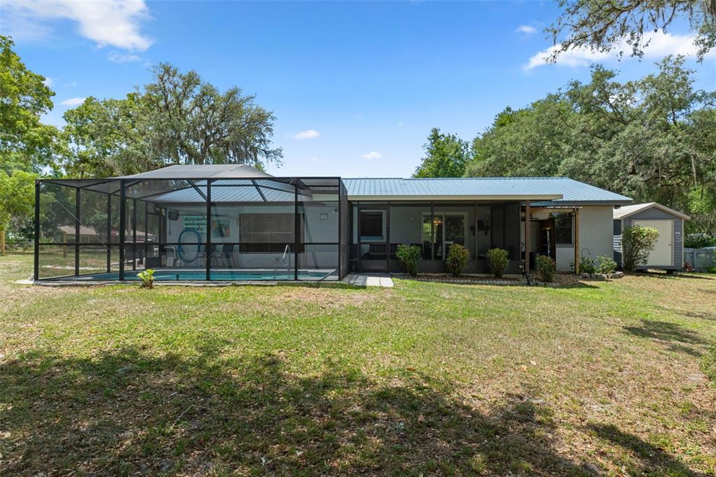 2481 South Summerwood Point Inverness, FL 34450 - Photo 3 of 38 a front view of a house with a garden