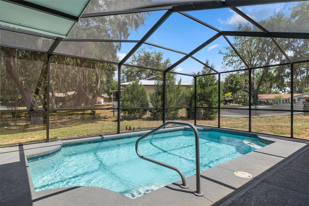 2481 South Summerwood Point Inverness, FL 34450 - Photo 33 of 38 a swimming pool with chairs
