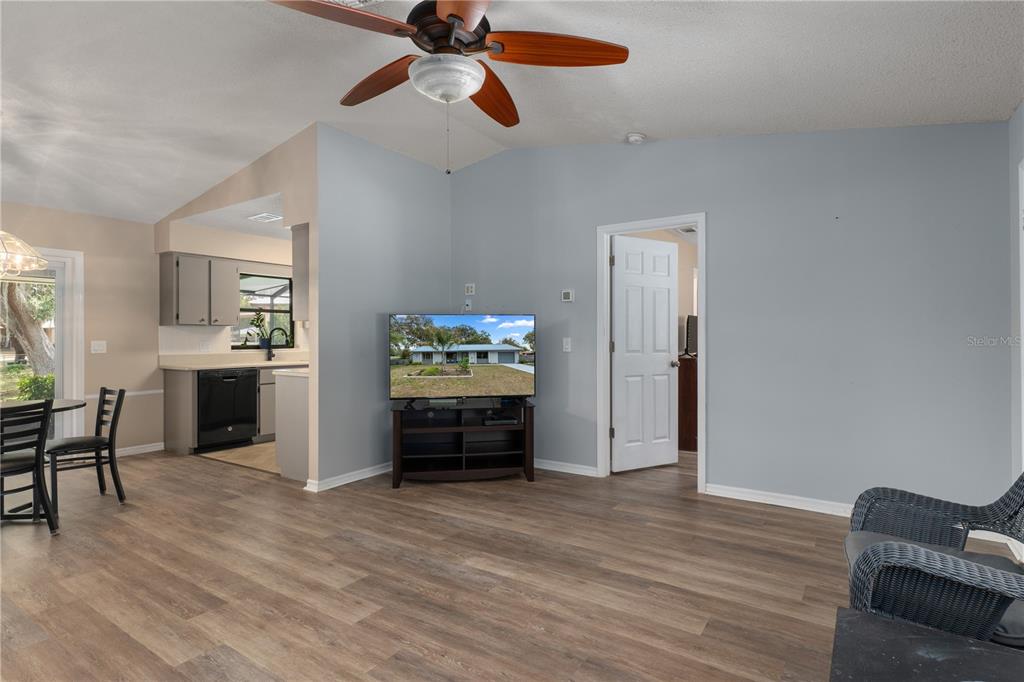 2481 South Summerwood Point Inverness, FL 34450 - Photo 8 of 38 a view of kitchen and dining room with wooden floor