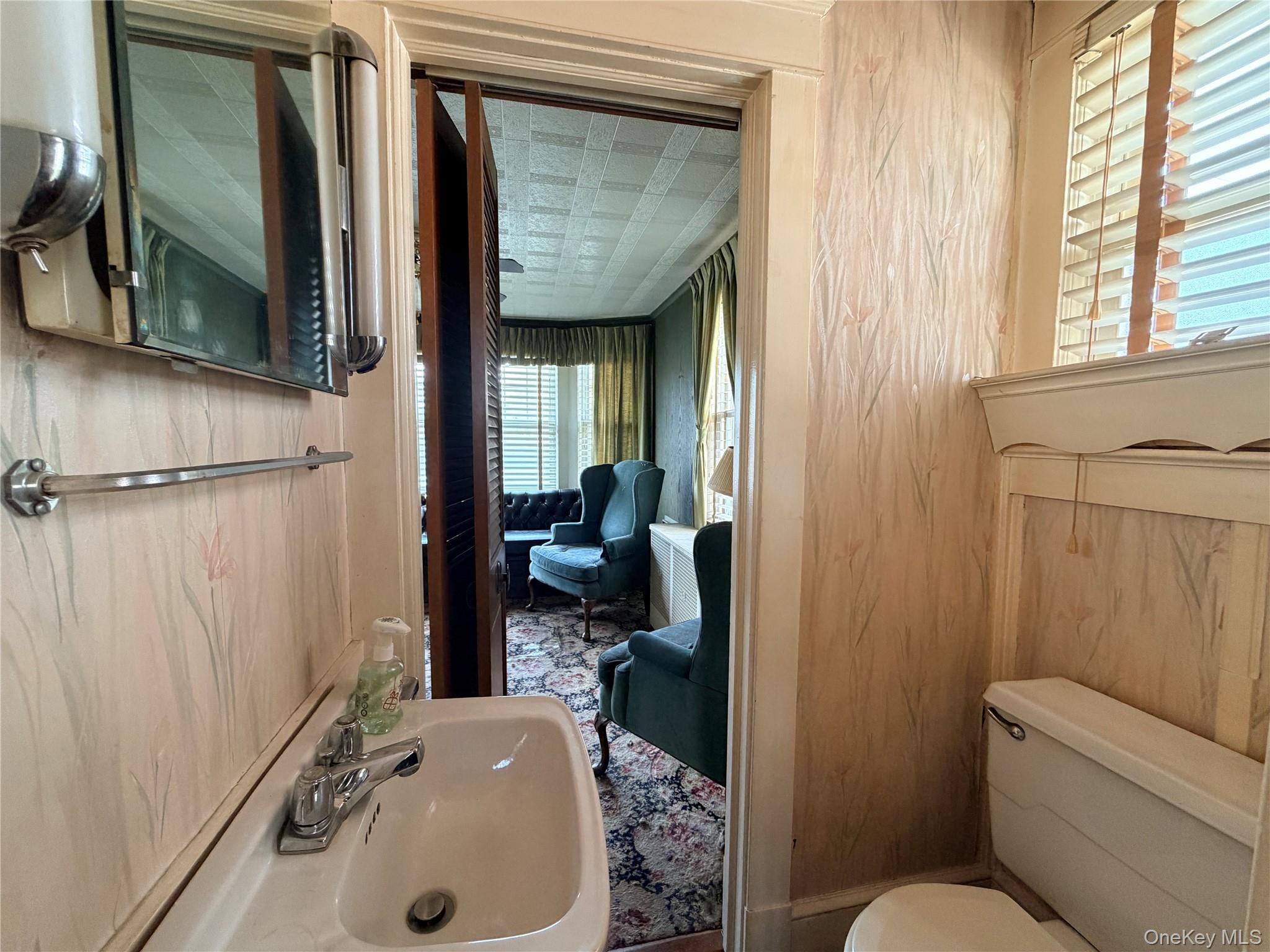 245 Woodbury Road Hicksville, NY 11801 - Photo 20 of 37 a bathroom with a sink toilet and shower