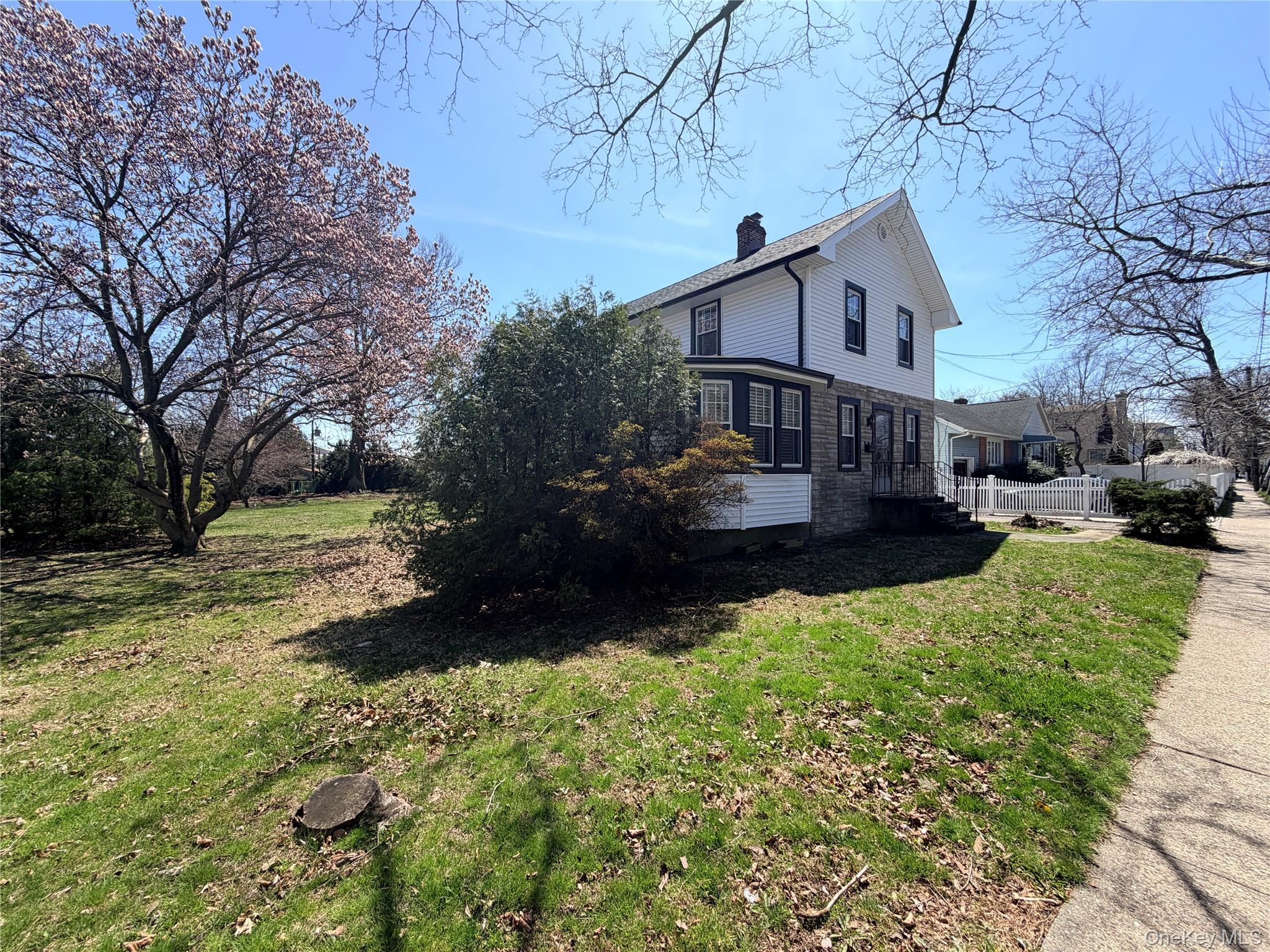 245 Woodbury Road Hicksville, NY 11801 - Photo 2 of 37 a view of a house with a yard