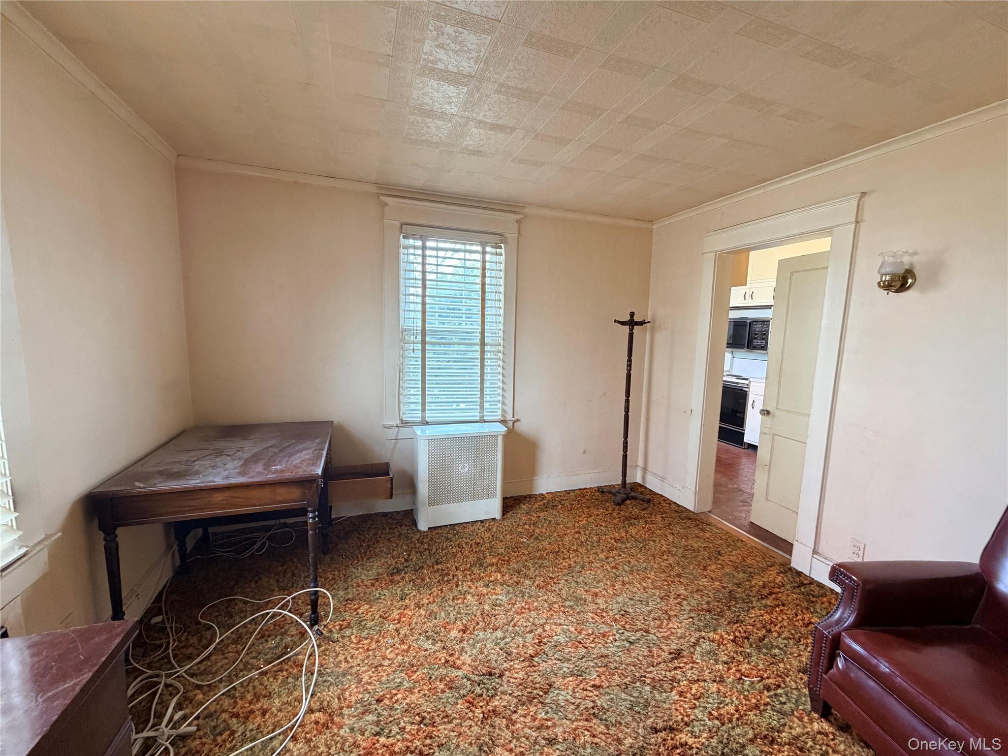 245 Woodbury Road Hicksville, NY 11801 - Photo 21 of 37 a bedroom with a bed and a window
