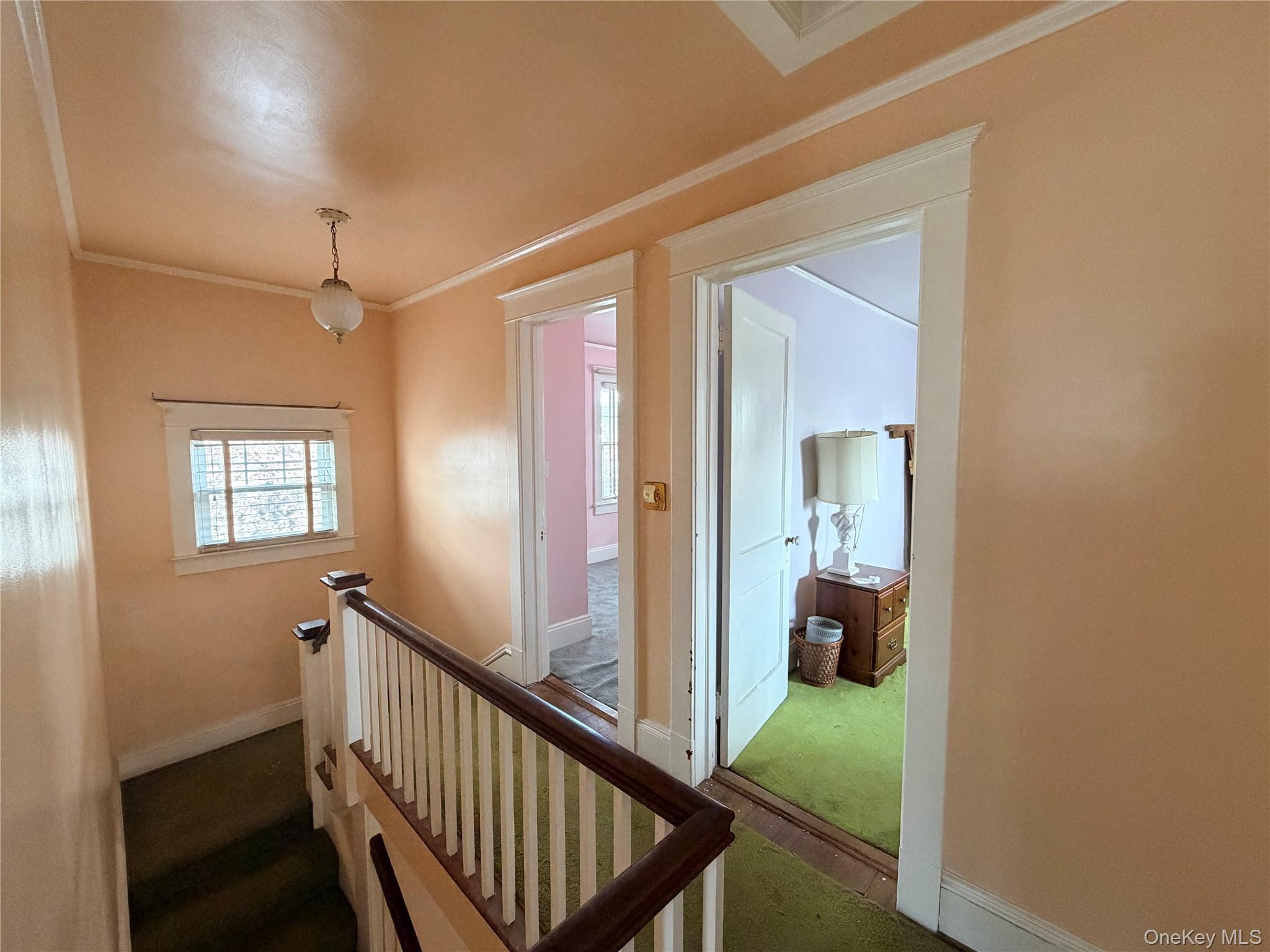 245 Woodbury Road Hicksville, NY 11801 - Photo 23 of 37 a view of a hallway and a livingroom with furniture