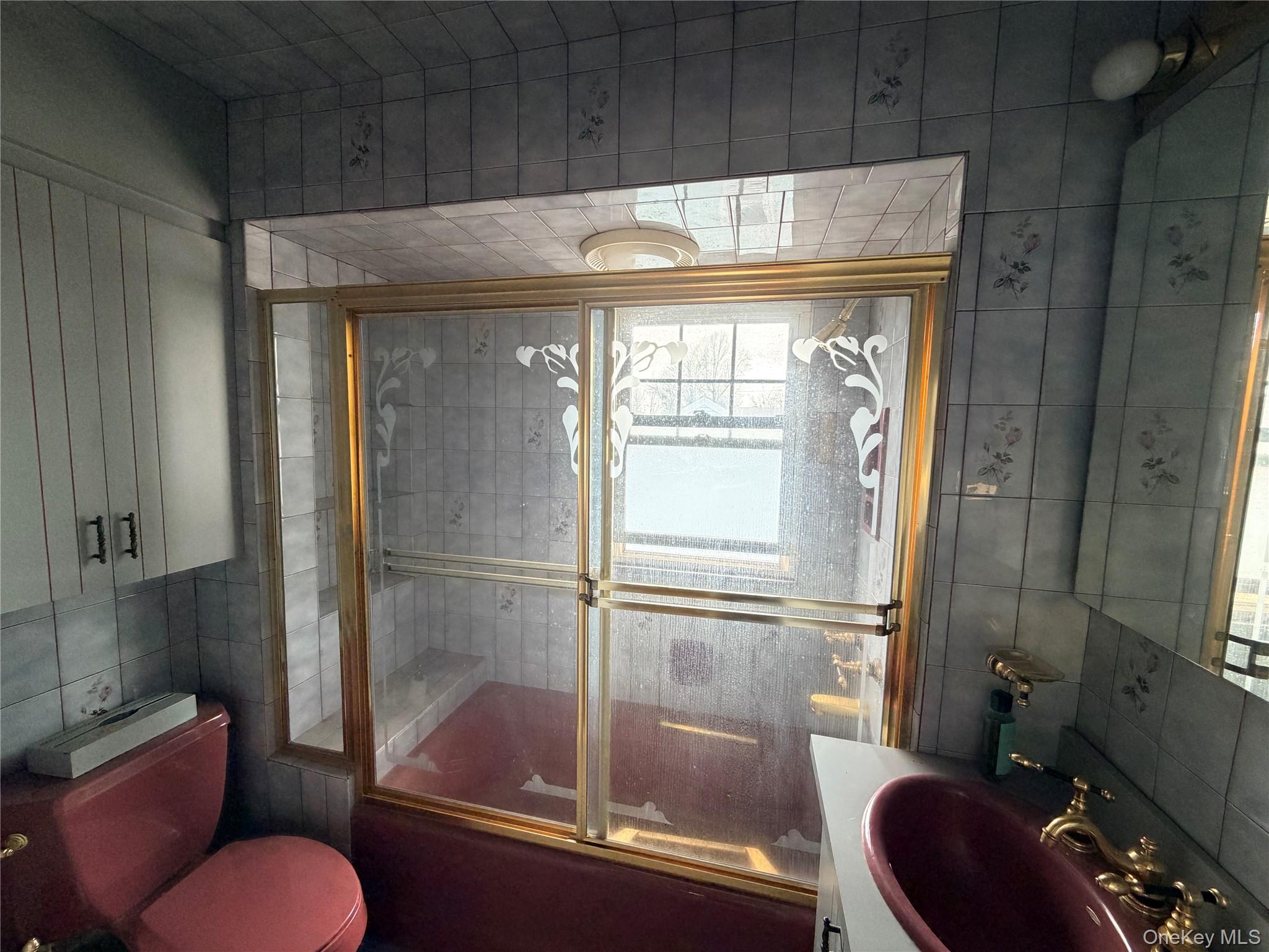 245 Woodbury Road Hicksville, NY 11801 - Photo 27 of 37 a bathroom with a shower toilet and sink