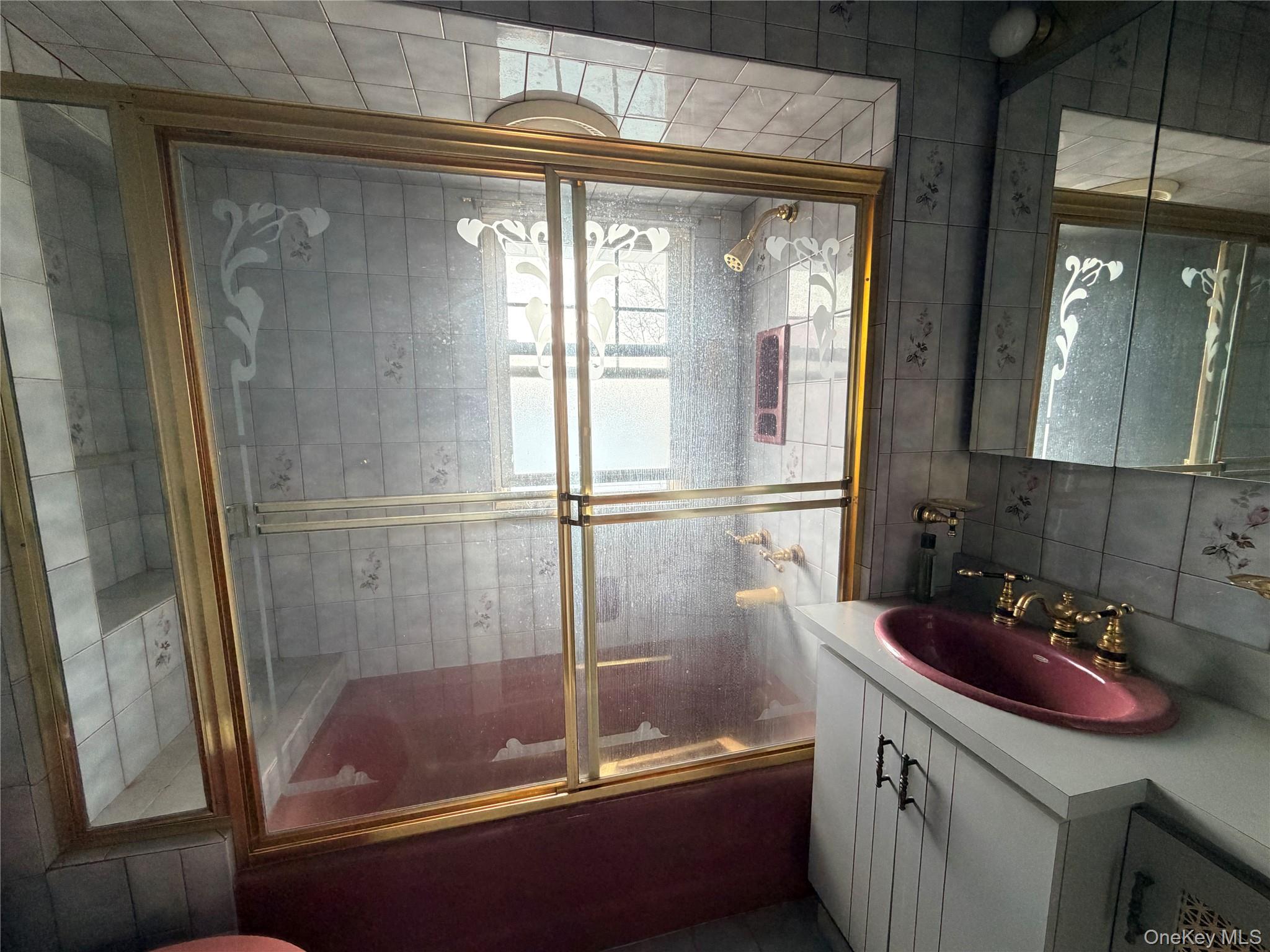 245 Woodbury Road Hicksville, NY 11801 - Photo 28 of 37 a bathroom with a shower and a sink