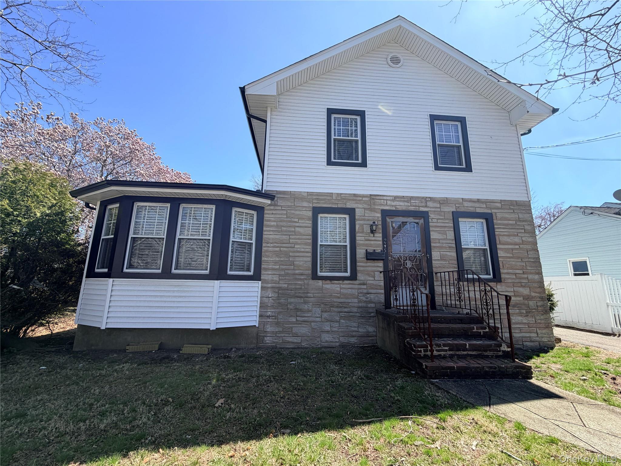 245 Woodbury Road Hicksville, NY 11801 - Photo 3 of 37 a front view of a house