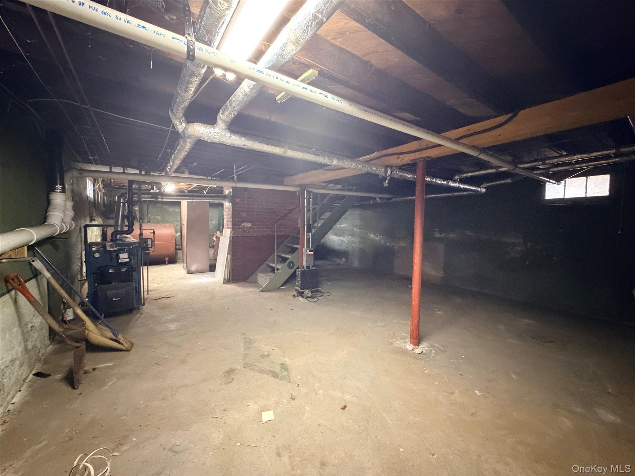 245 Woodbury Road Hicksville, NY 11801 - Photo 31 of 37 a view of empty room with wooden floor