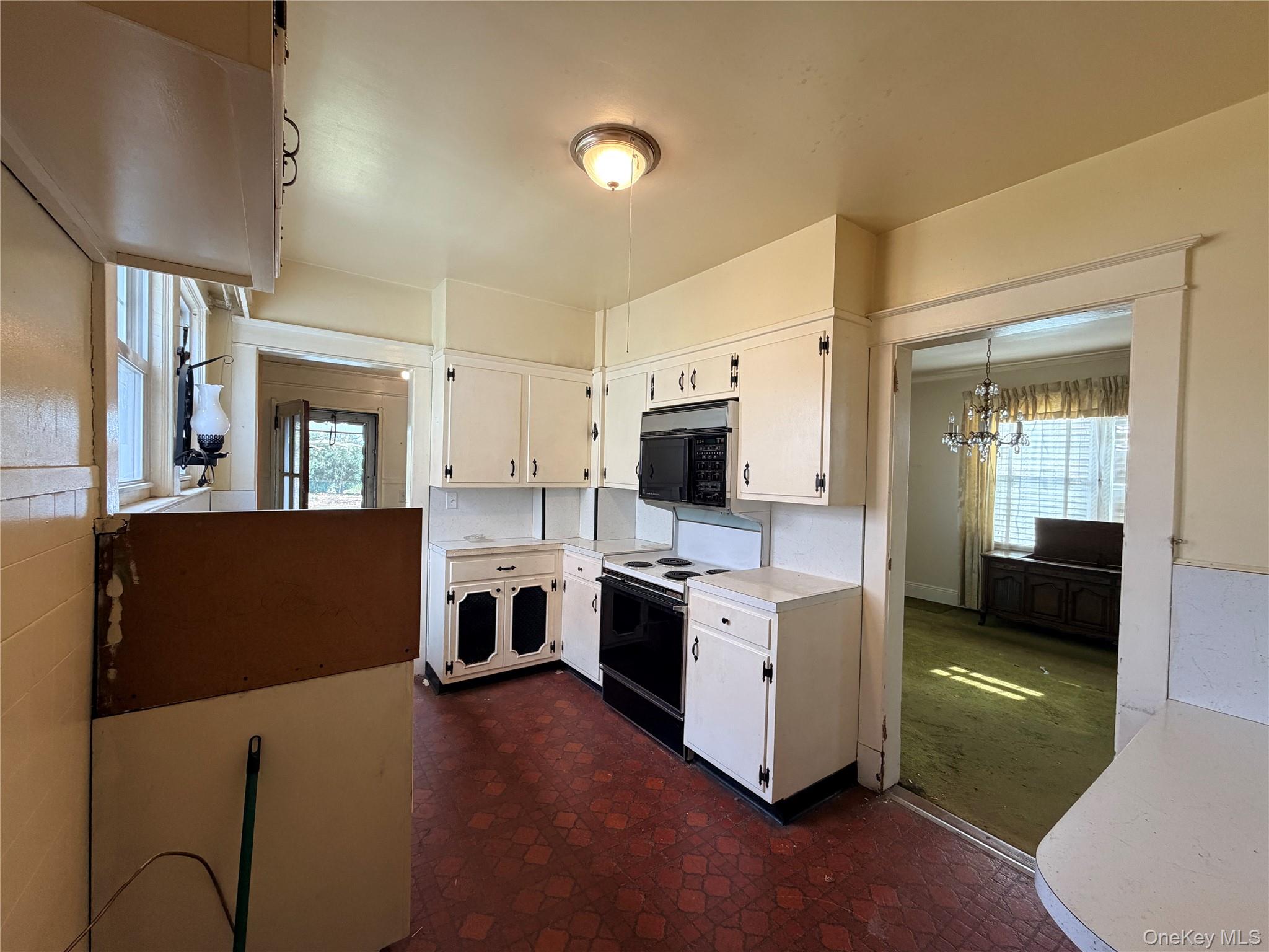 245 Woodbury Road Hicksville, NY 11801 - Photo 6 of 37 a view of living room kitchen with stainless steel appliances wooden floor and view living room