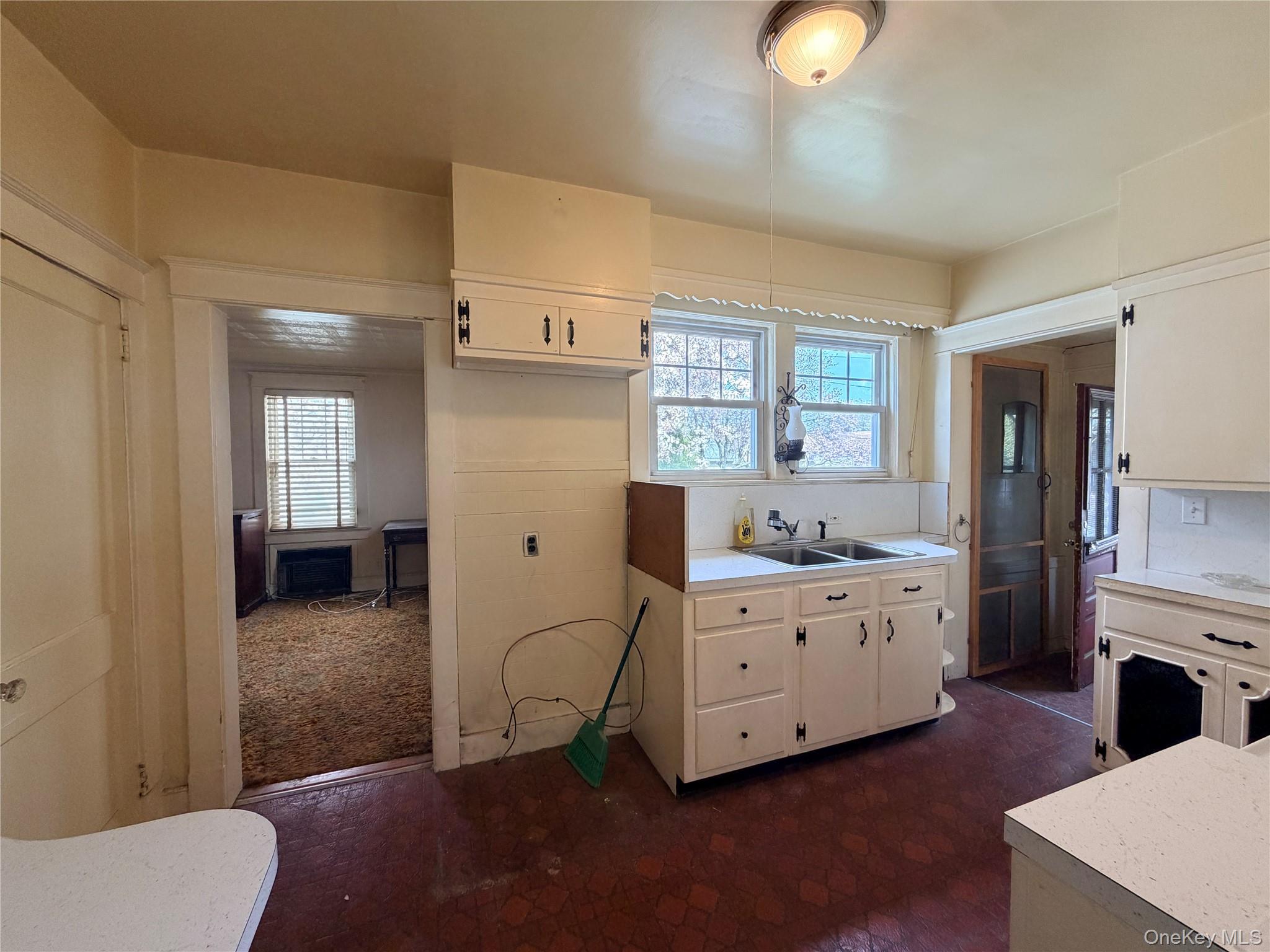 245 Woodbury Road Hicksville, NY 11801 - Photo 7 of 37 a living room with furniture and a dresser