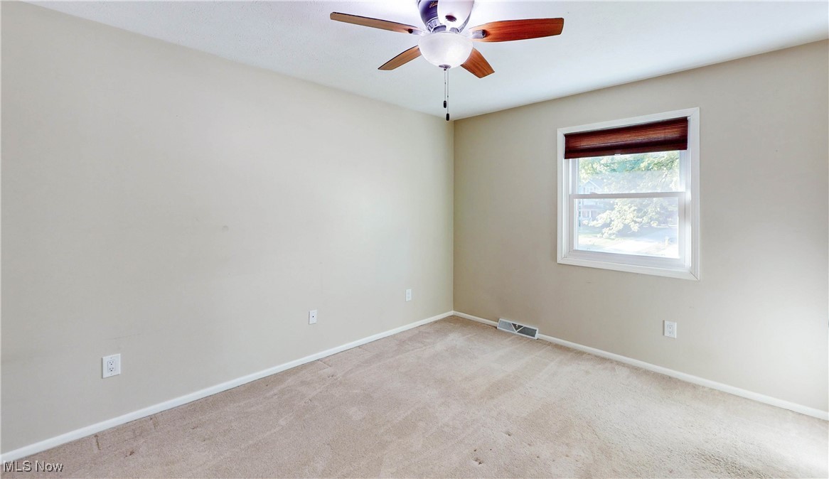3491 Kent Road Stow, OH 44224 - Photo 25 of 40 Bedroom # 3 with ceiling fan, window and carpet