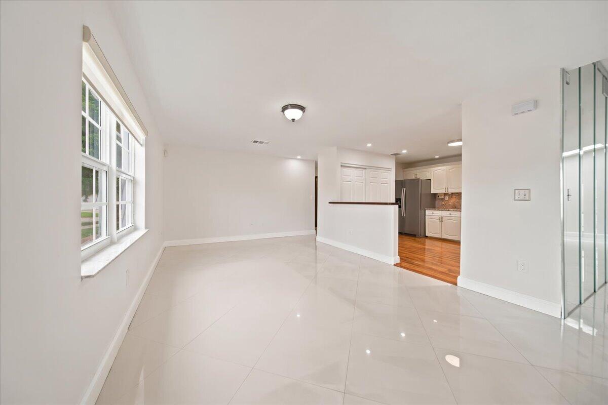 20009 Northwest 66th Place Hialeah, FL 33015 - Photo 10 of 33 a view of an empty room with kitchen and a window