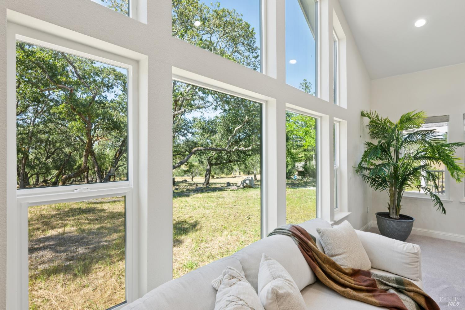 4665 Upper Ridge Road Santa Rosa, CA 95404 - Photo 5 of 71 a living room with furniture and floor to ceiling windows