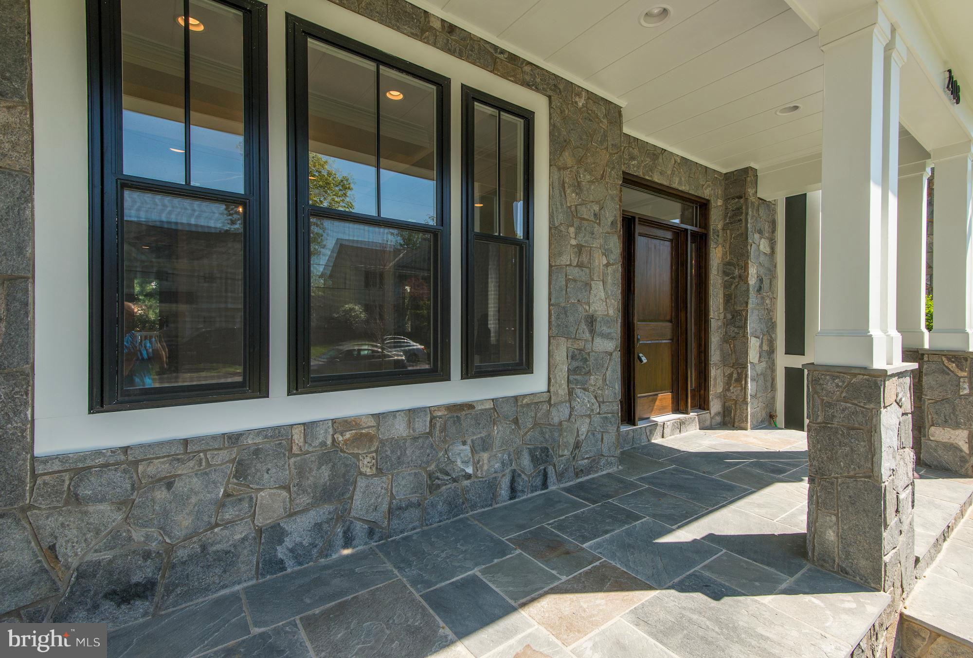 2108 Windsor Road Alexandria, VA 22307 - Photo 2 of 30 a front view of a house with a glass door
