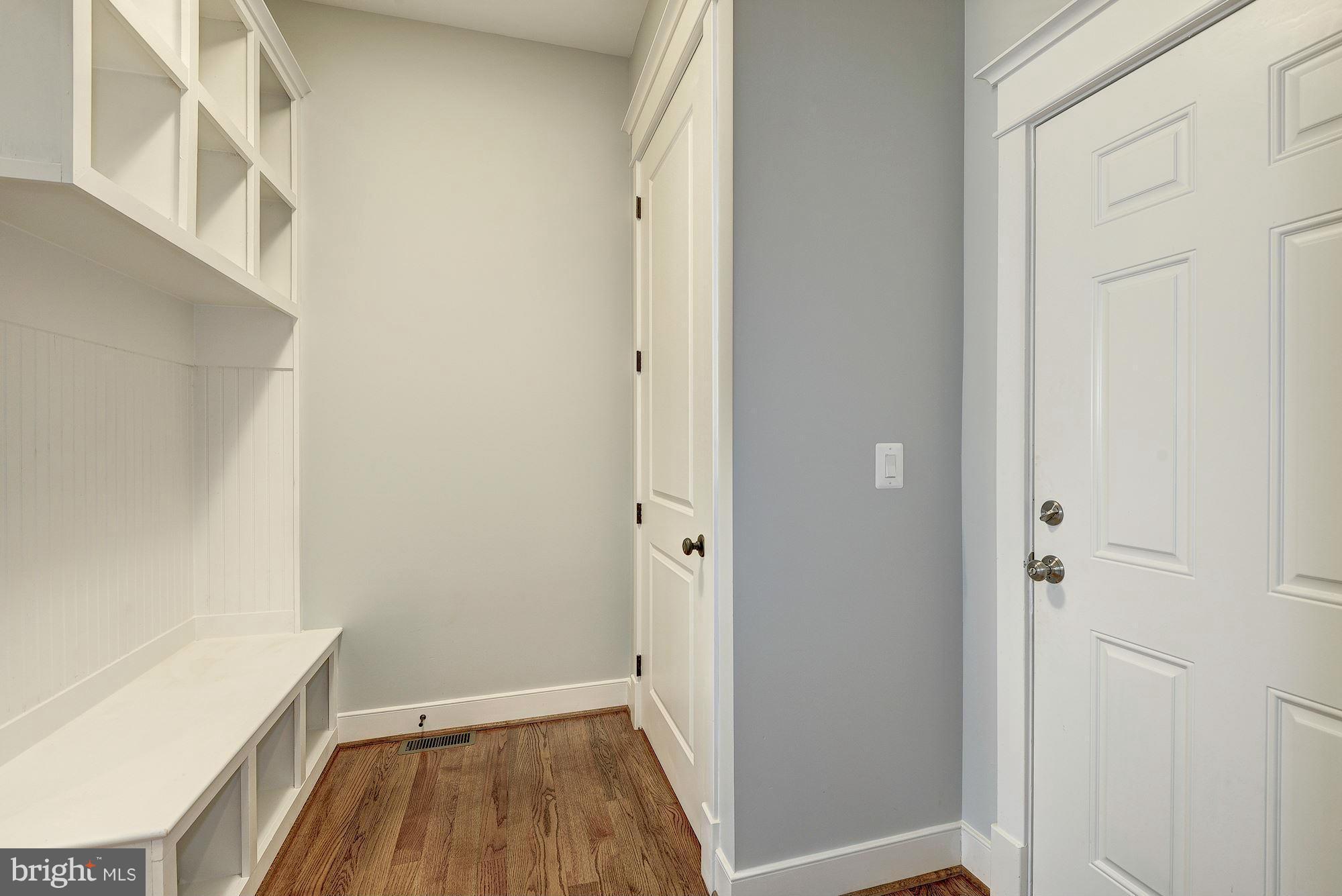 2108 Windsor Road Alexandria, VA 22307 - Photo 15 of 30 a view of a hallway with wooden floor and staircase