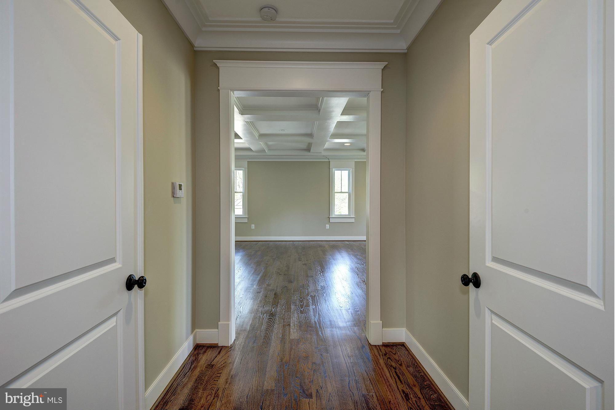 2108 Windsor Road Alexandria, VA 22307 - Photo 22 of 30 a view of a hallway with wooden floor