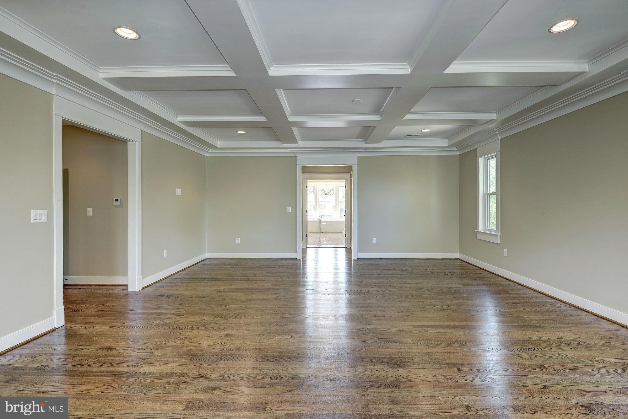 2108 Windsor Road Alexandria, VA 22307 - Photo 23 of 30 a view of an empty room with wooden floor and a window