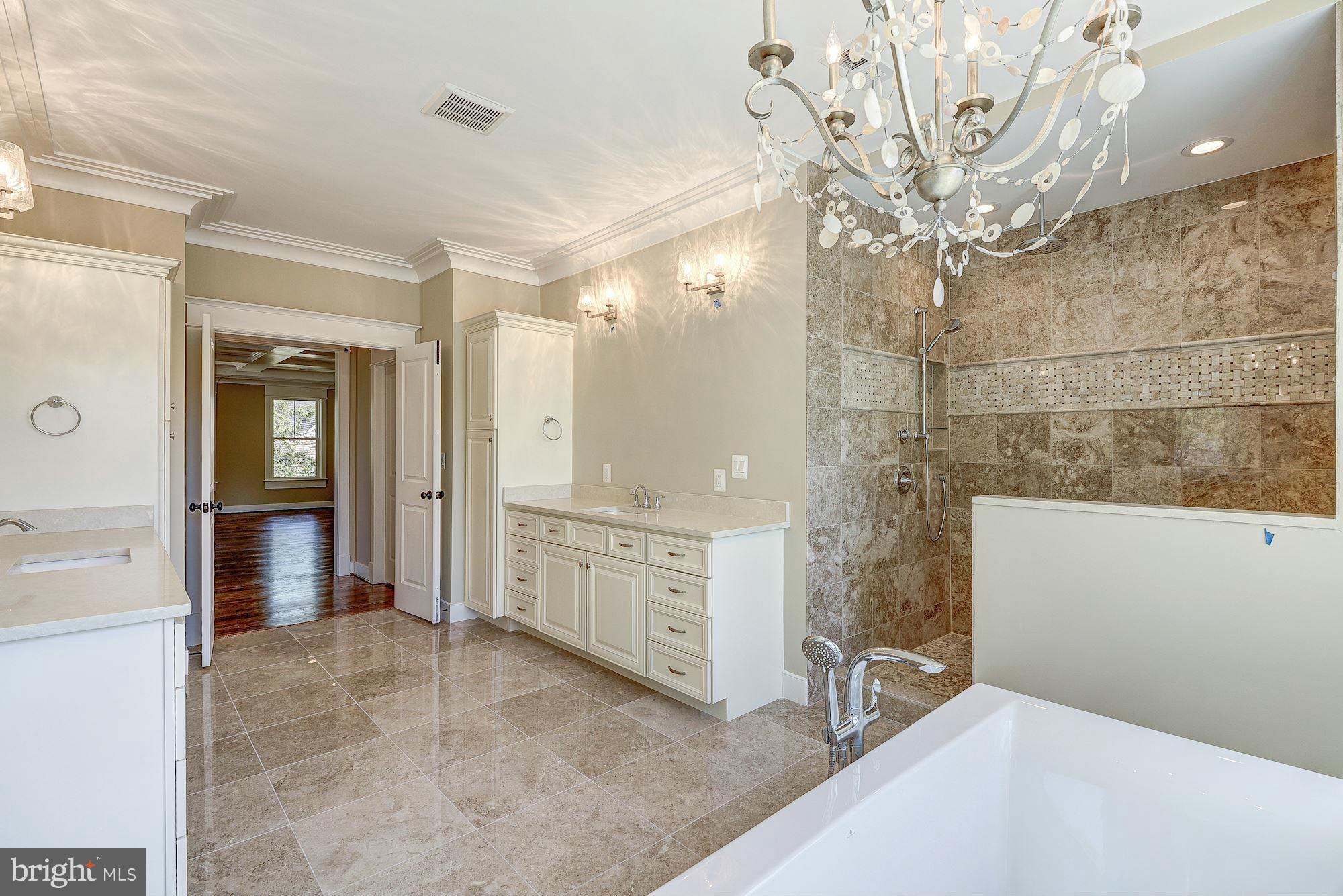 2108 Windsor Road Alexandria, VA 22307 - Photo 27 of 30 a bathroom with a sink a mirror and a shower