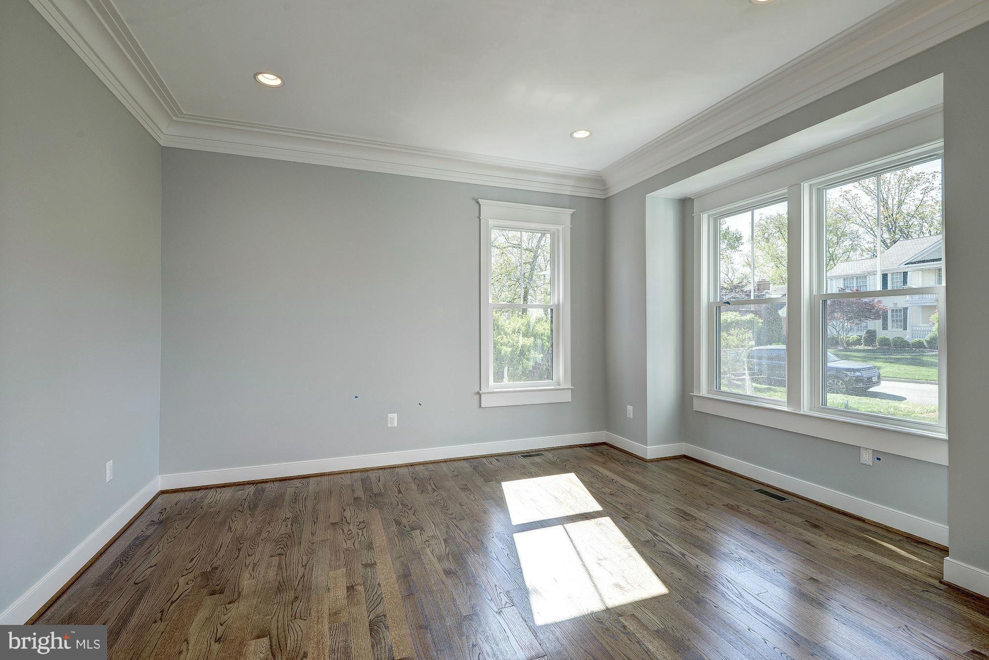 2108 Windsor Road Alexandria, VA 22307 - Photo 4 of 30 a view of empty room with wooden floor and fan