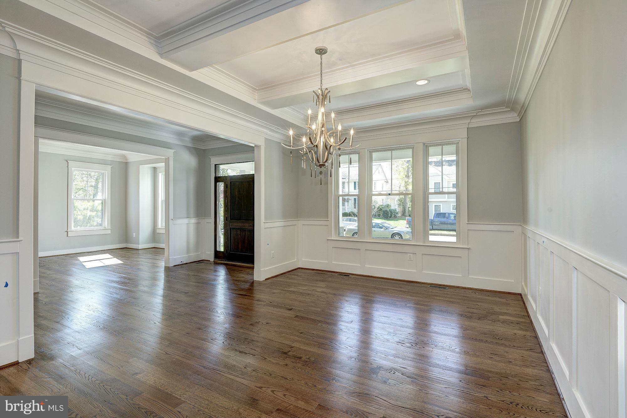 2108 Windsor Road Alexandria, VA 22307 - Photo 6 of 30 a view of a room with wooden floors and chandelier