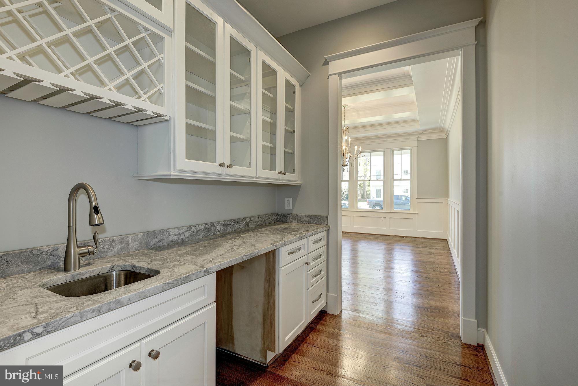 2108 Windsor Road Alexandria, VA 22307 - Photo 7 of 30 a kitchen with a sink and cabinets
