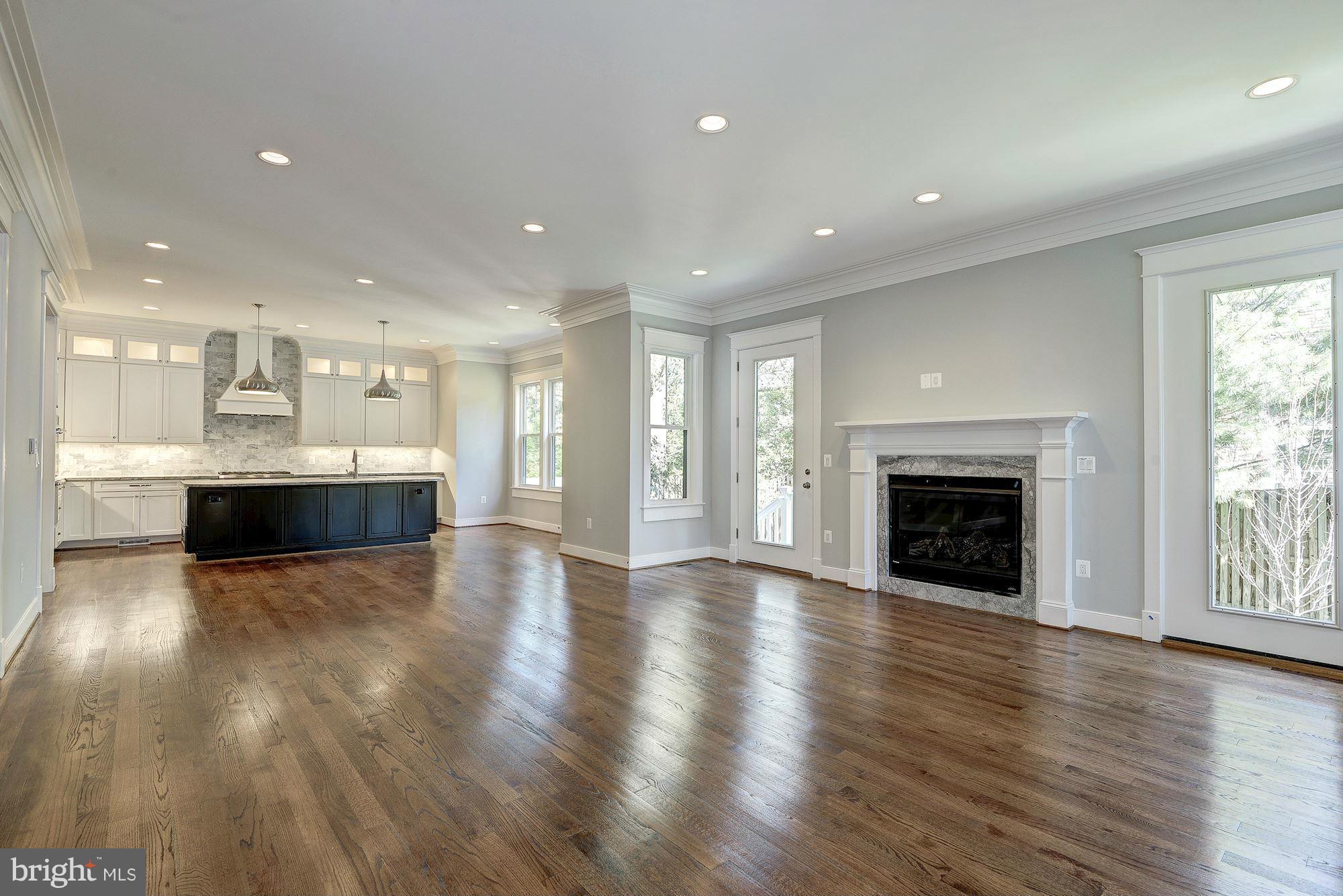 2108 Windsor Road Alexandria, VA 22307 - Photo 9 of 30 a view of an empty room and a kitchen with wooden floor
