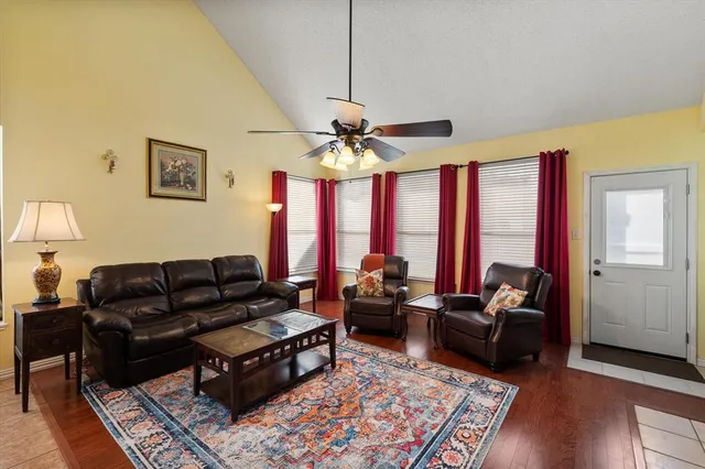 a living room with furniture and a large window