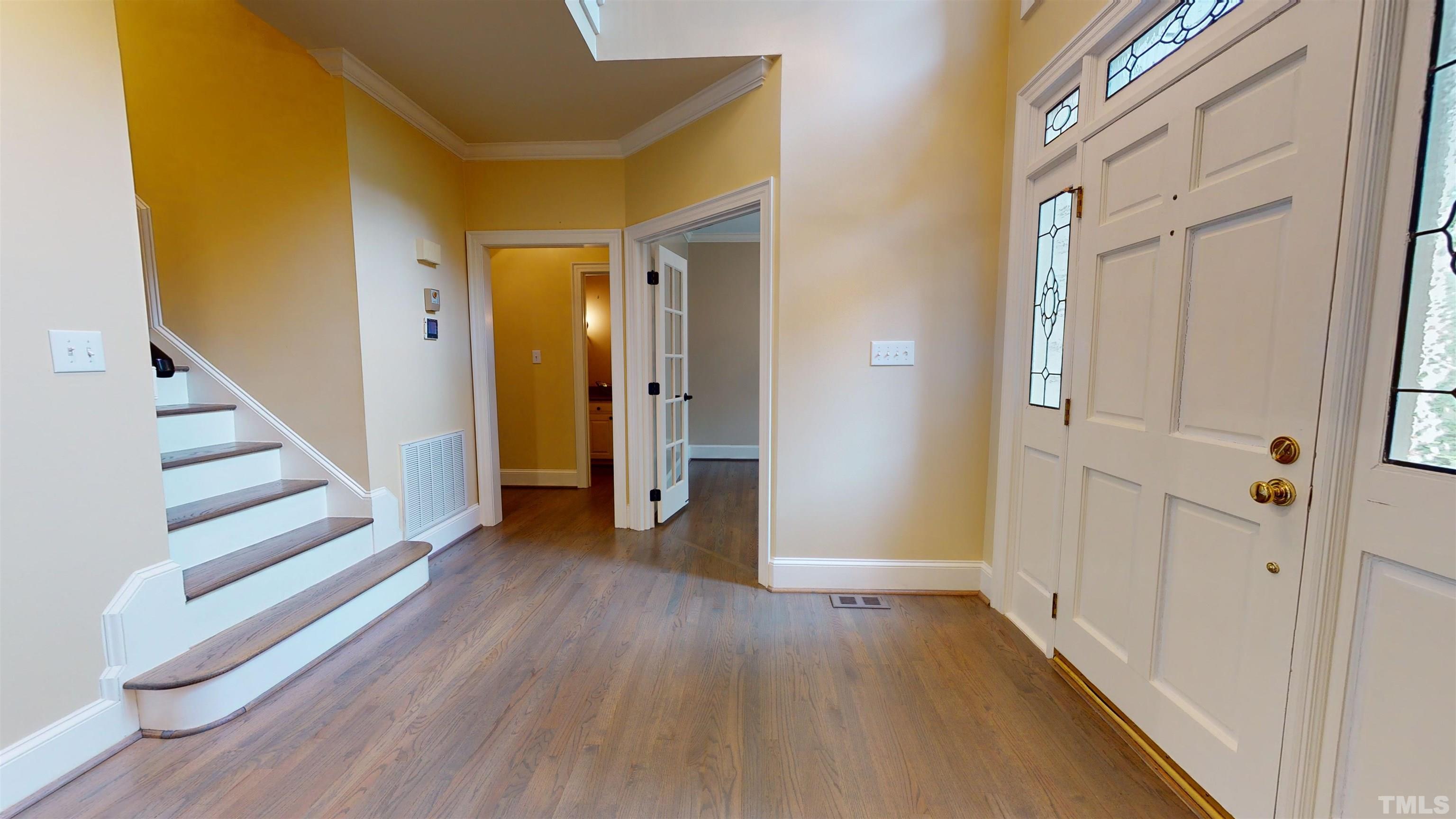 1624 Adams Mountain Road Raleigh, NC 27614 - Photo 13 of 100 a view of a hallway with wooden floor and entryway