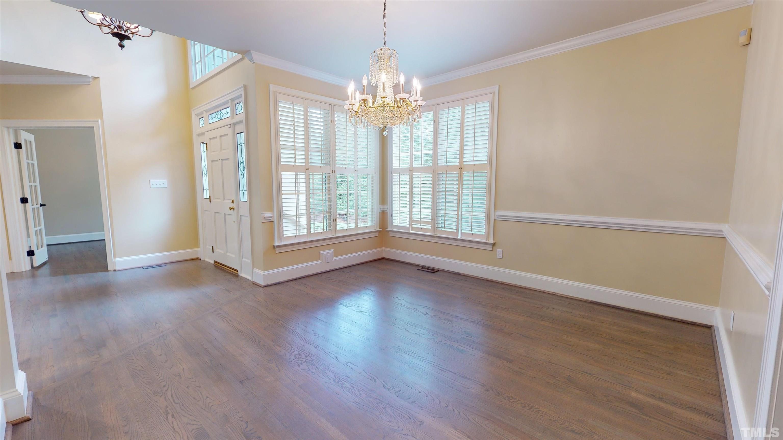 1624 Adams Mountain Road Raleigh, NC 27614 - Photo 14 of 100 a view of an empty room with wooden floor and a window