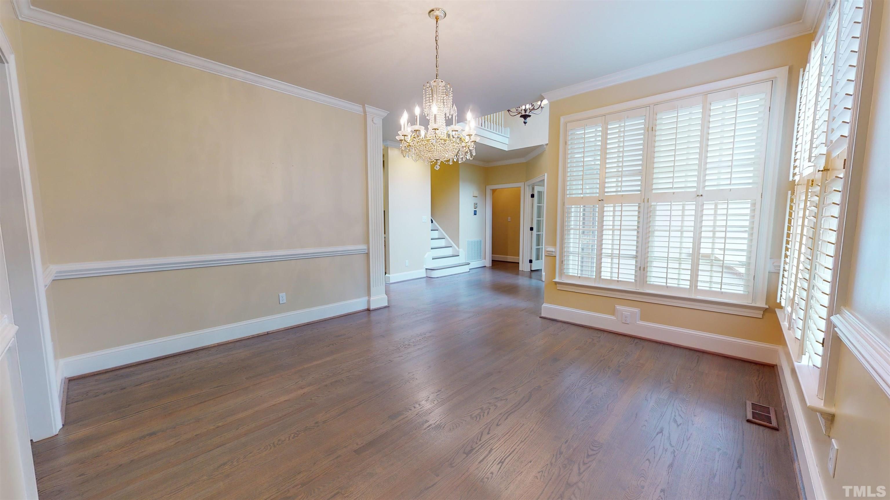 1624 Adams Mountain Road Raleigh, NC 27614 - Photo 15 of 100 a view of an empty room with wooden floor and a window