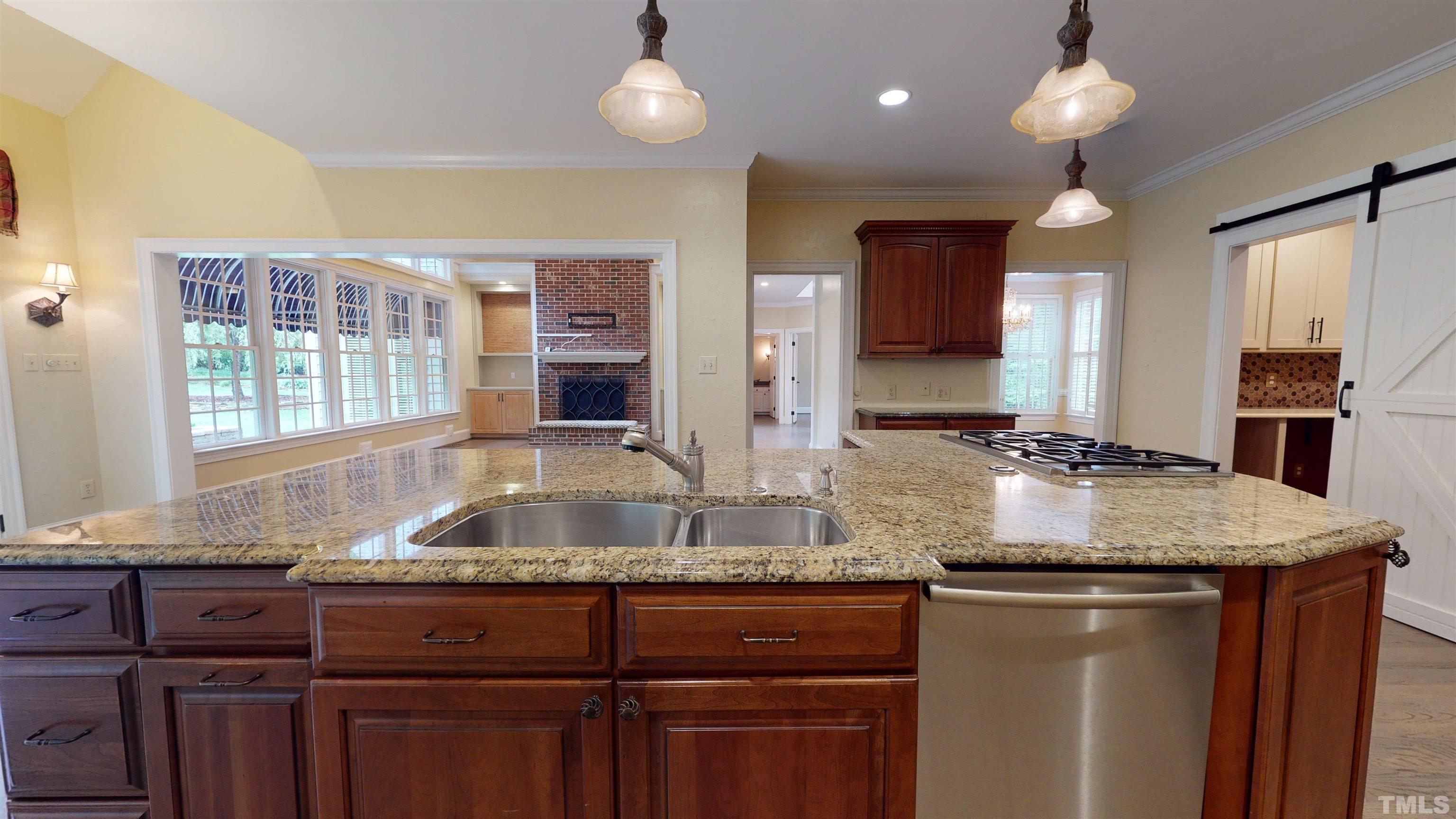 1624 Adams Mountain Road Raleigh, NC 27614 - Photo 20 of 100 a kitchen with granite countertop a sink and a window