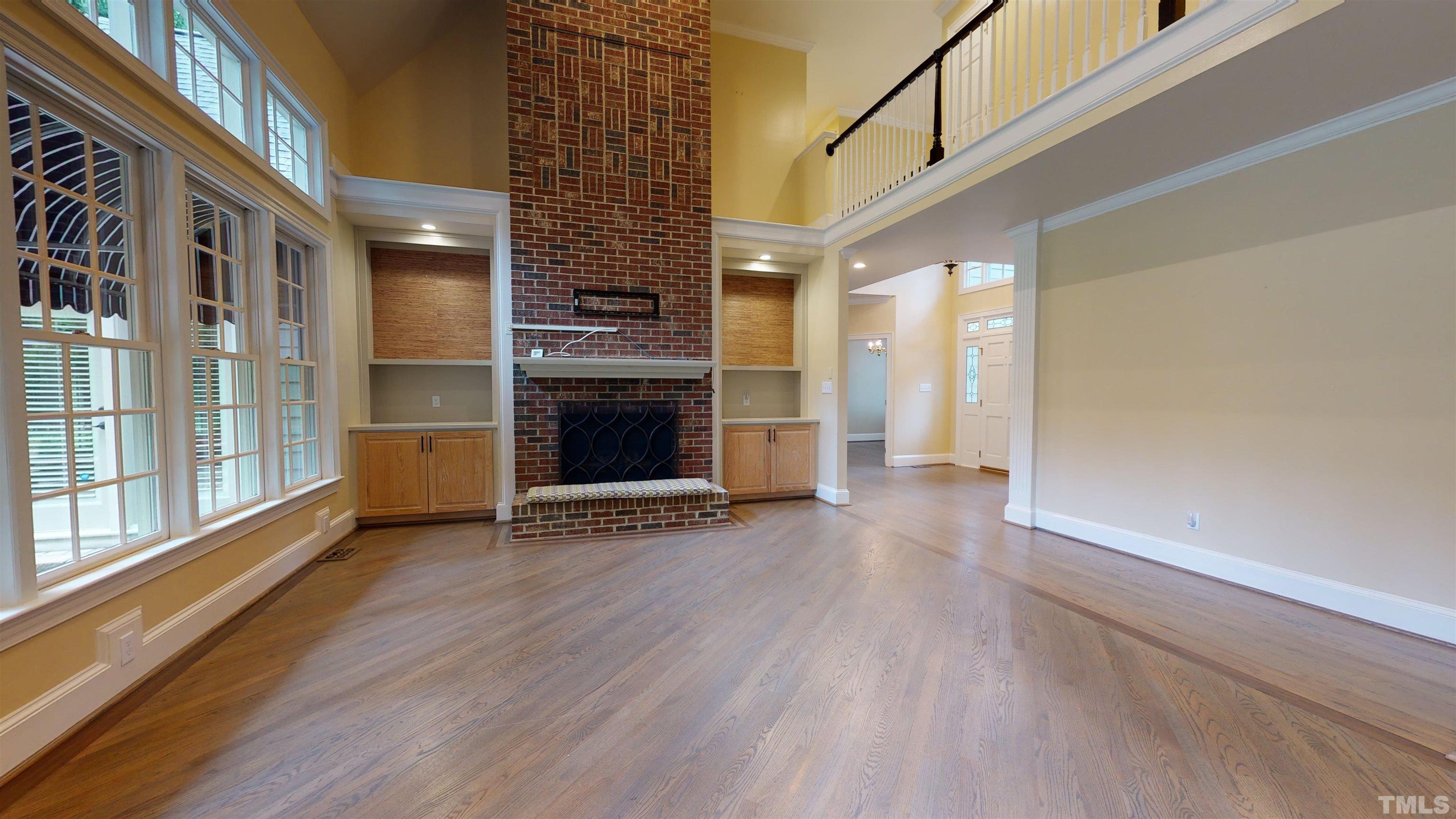 1624 Adams Mountain Road Raleigh, NC 27614 - Photo 35 of 100 a view of an empty room with wooden floor and a window