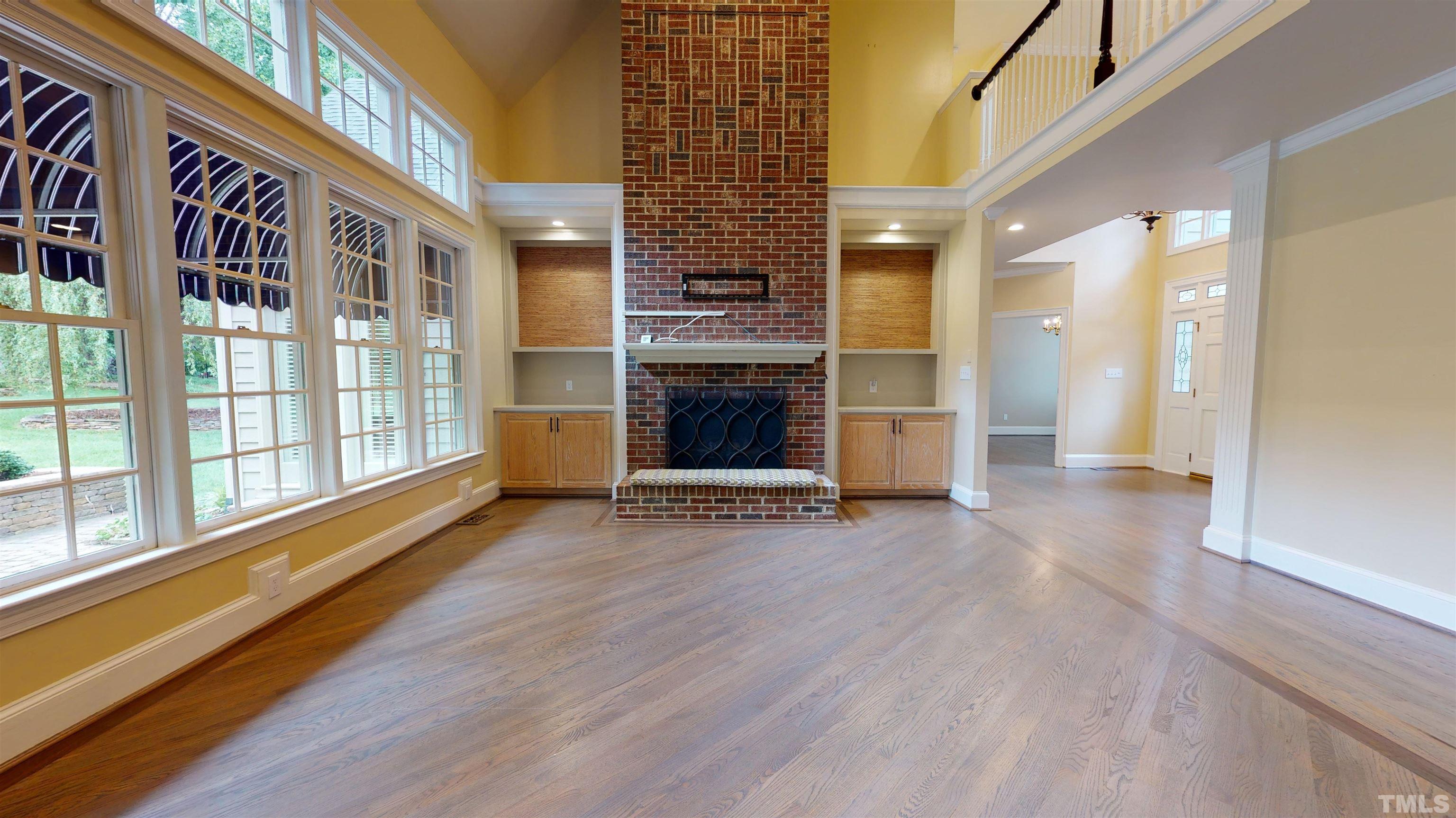 1624 Adams Mountain Road Raleigh, NC 27614 - Photo 39 of 100 a view of an empty room with a fireplace and a window